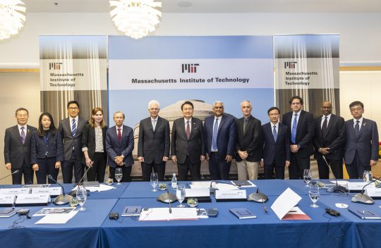 Group of MIT faculty members standing with President Yoon Suk Yeol of South Korea and his team.